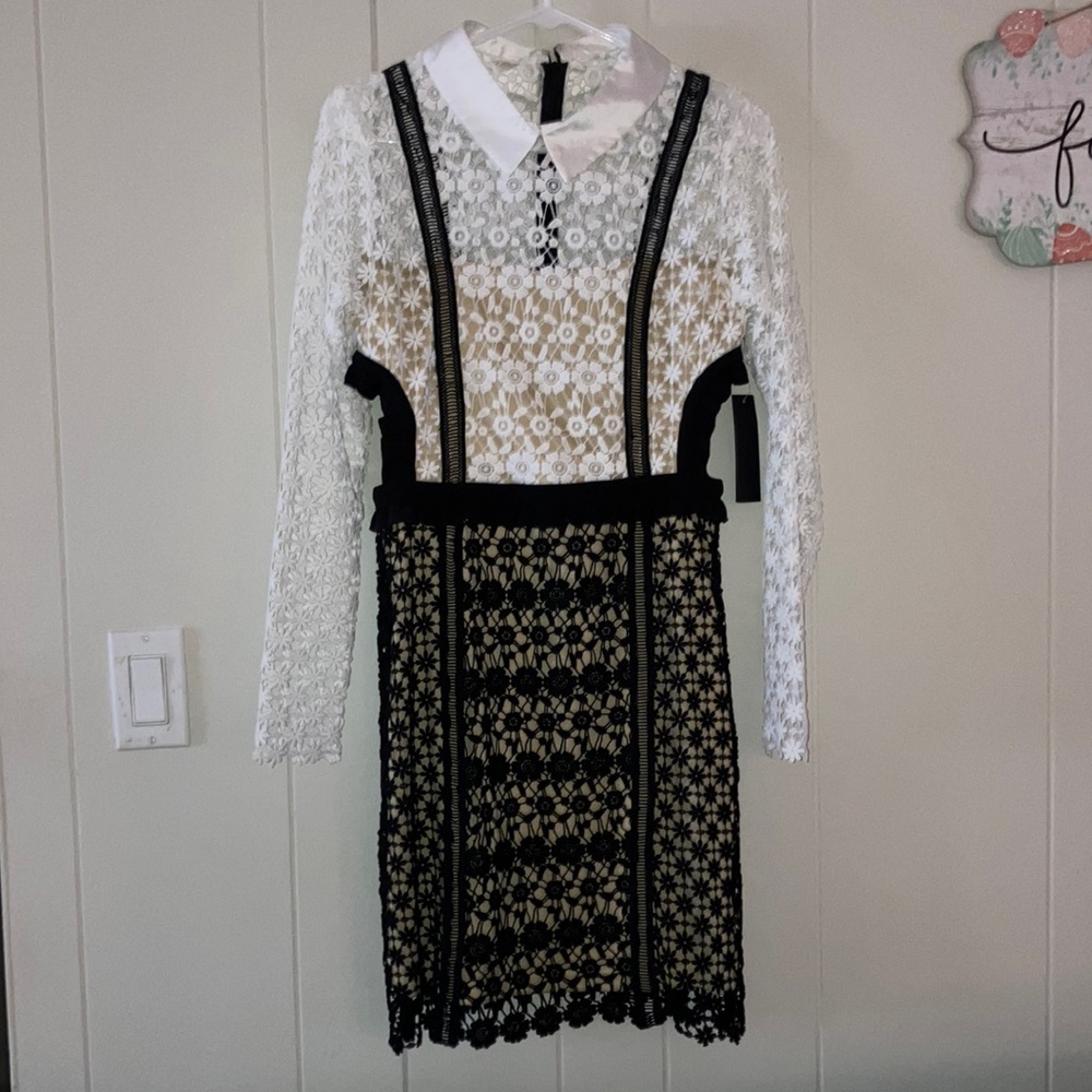 Gorgeous black and white stitched floral lace cut-out mini dress .